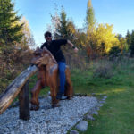 Tim Hills riding a wooden horse